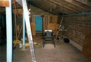 The Chicken house studio floor now cleaned up and renovations beginning. A door in place, a table saw, ladder and other evidence of work.