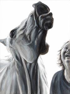 intimate portrait of horse and woman both seen from neck looking up. heads up in laughter
